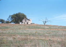 Photograph of the limestone slaughter house building from the tornado scene.
