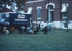 Actors and crew members on a break outside of the courthouse used for the trial scene.