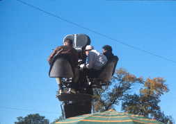 Director Gordon Parks, right, and two production crew members filming from above by the Phillips 66 gas station.
