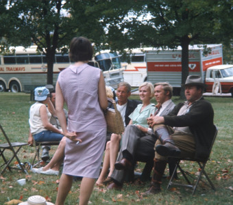 Actors, including Malcolm Atterbury (Silas Newhall), Don Dubbins (Harley Davis), and Dana Elcar (Kirky), sit in front of production vehicles.