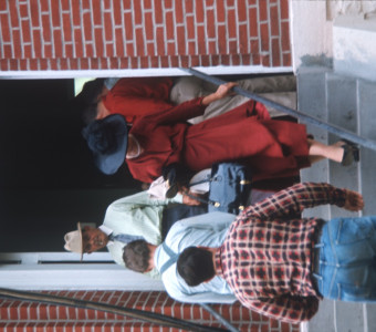 Two actors entering and two exiting the courthouse used in the trial scene.