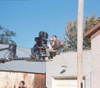 Production crew, including DIrector Gordon Parks (behind camera), filming from above in downtown Fort Scott, Kansas.
