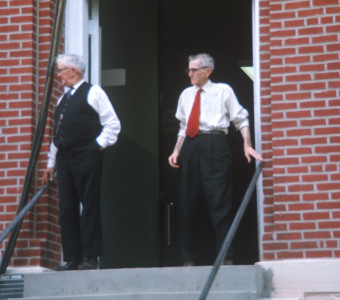 Actors exiting the courthouse from the trial scene.