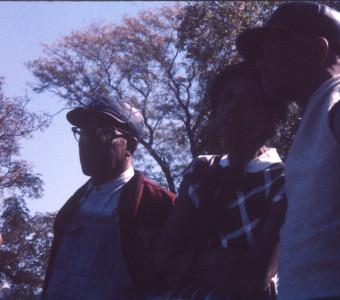 Actors and crew discussing a scene.
