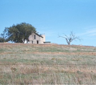 Photograph of the limestone slaughter house building from the tornado scene.