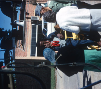 Director Gordon Parks (seated) and crew or actors in downtown Fort Scott, Kansas.
