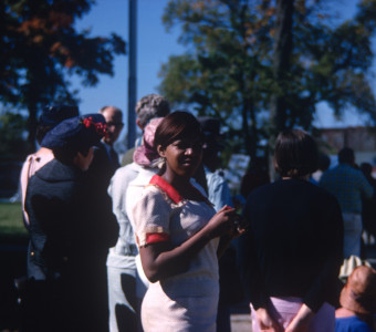 Actress S. Pearl Sharp (Prissy) poses for the camera in front of other actors.