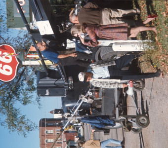 Production crew preparing equipment in downtown Fort Scott, Kansas in front of a Phillips 66 gas station.