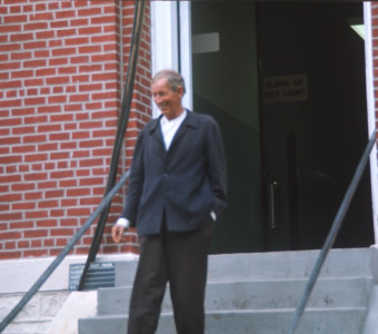 Actor Malcolm Atterbury (Silas Newhall) exiting courthouse building used in the trial scene.