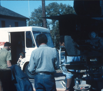 Director Gordon Parks, center and facing away from the photographer, with production crew and camera.
