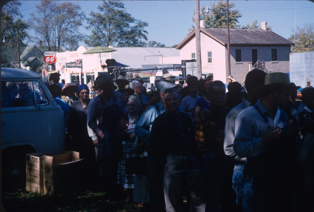 Learning Tree actors and crew in line in downtown Fort Scott, Kansas Actors, crew, and others in line, likely for food, in downtown Fort Scott, Kansas.