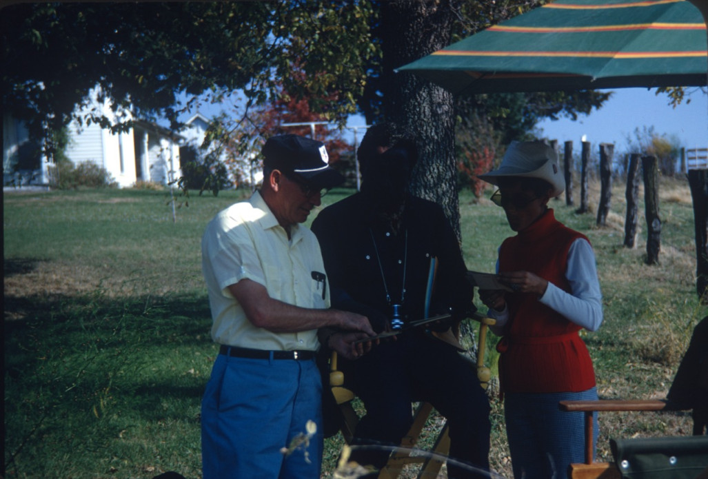 Production crew members and Director Gordon Parks (center) outside of set for Winger Home.