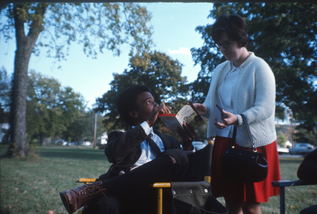 Actor Kyle Johnson holding Learning Tree novel, talking to actress Peggy Rea Lead Actor Kyle Johnson (Newt Winger) points out a part of Gordon Parks’ novel version of The Learning Tree to Peggy Rea (Miss McClintock).