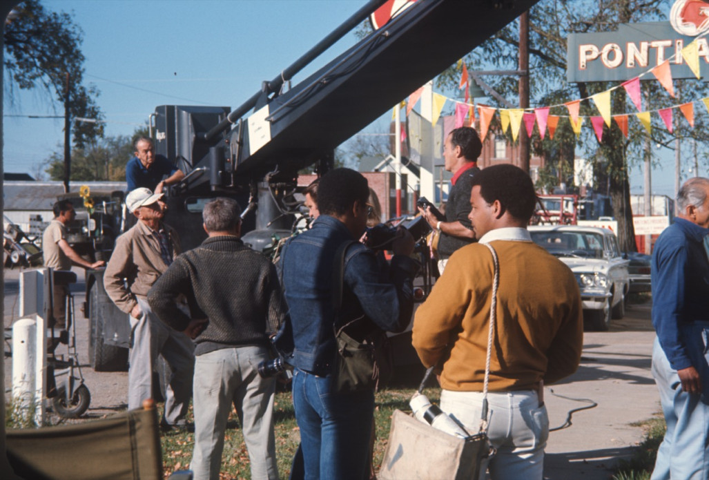 Gordon Parks' eldest son, Gordon Parks Junior, holdS a camera as crew film a scene in downtown Fort Scott, Kansas.