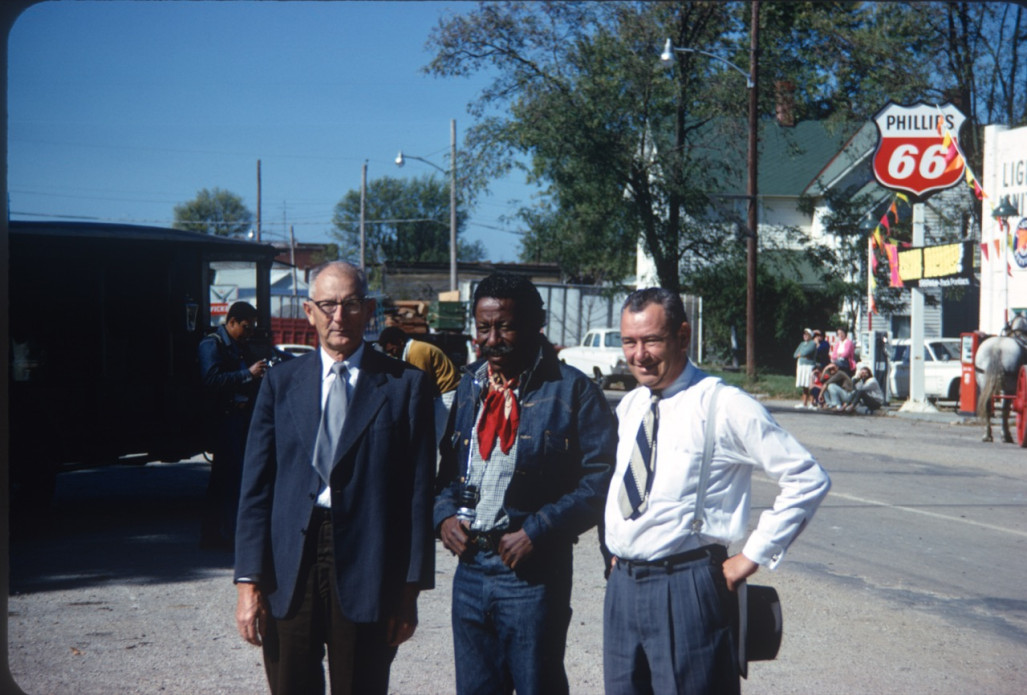 Director Gordon Parks (center) and two actors pose for a photograph on set in downtown Fort Scott, Kansas.