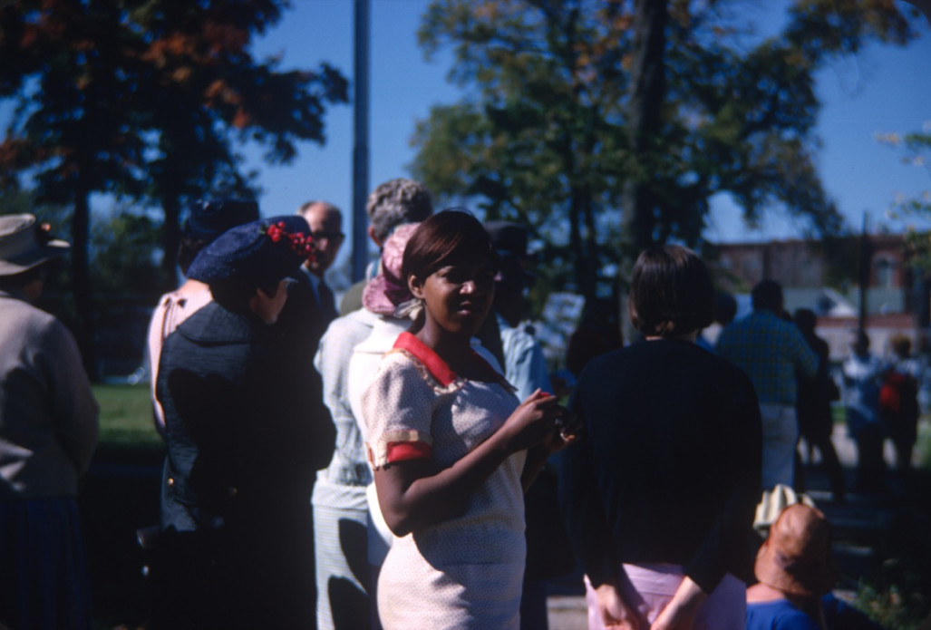 Actress S. Pearl Sharp (Prissy) poses for the camera in front of other actors.