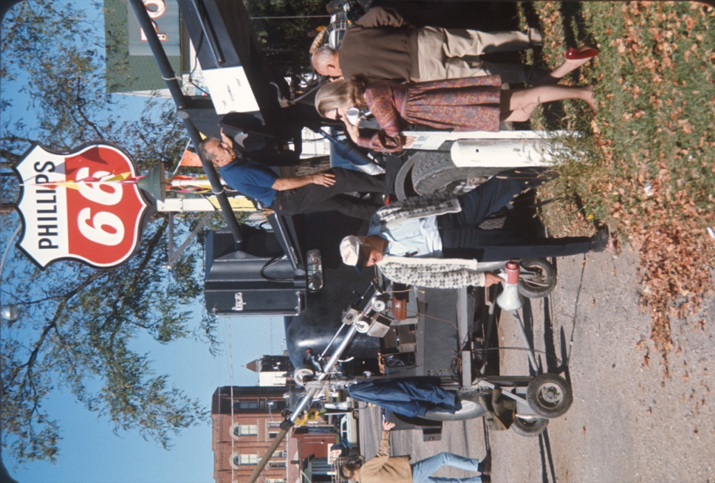 Production crew preparing equipment in downtown Fort Scott, Kansas in front of a Phillips 66 gas station.