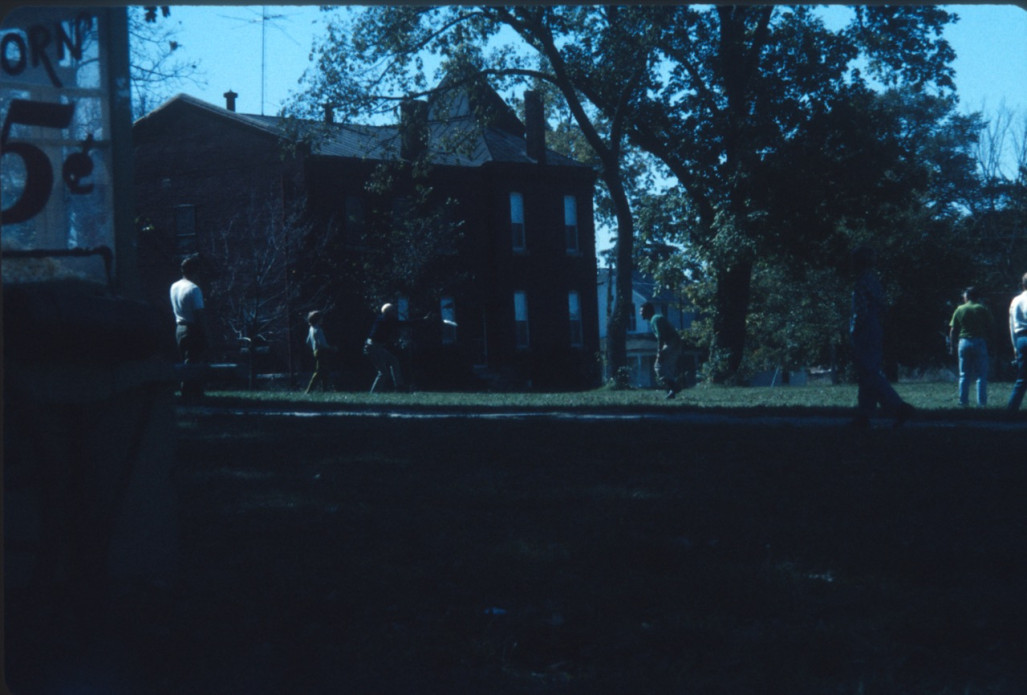 Cast and crew playing frisbee