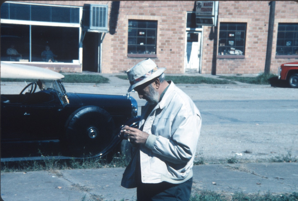 Man with camera in downtown Fort Scott, Kansas.